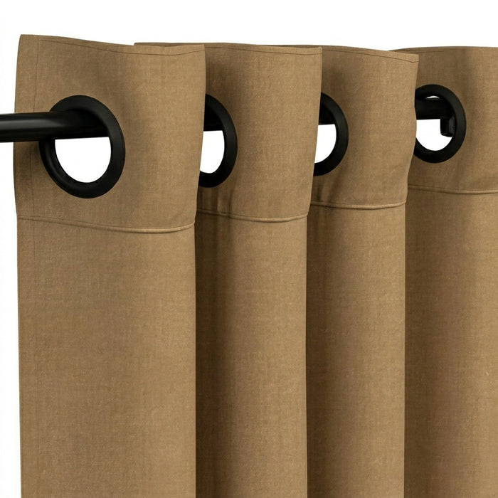 A close-up of tan or camel-colored curtain panels with black grommets and a black curtain rod, shown against a white background.