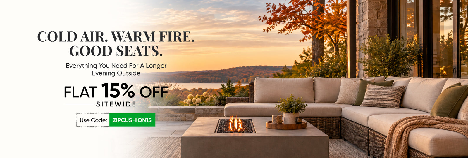 Beige outdoor sectional with fire pit table overlooking a sunset lake, autumn foliage. Use code ZIPCUSHION15 for 15% off